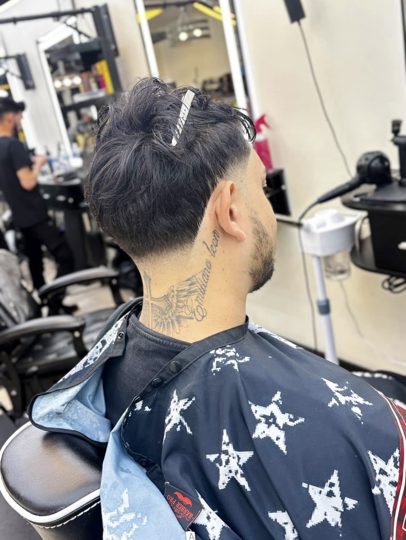 Oscar A. Barber haircut in progress