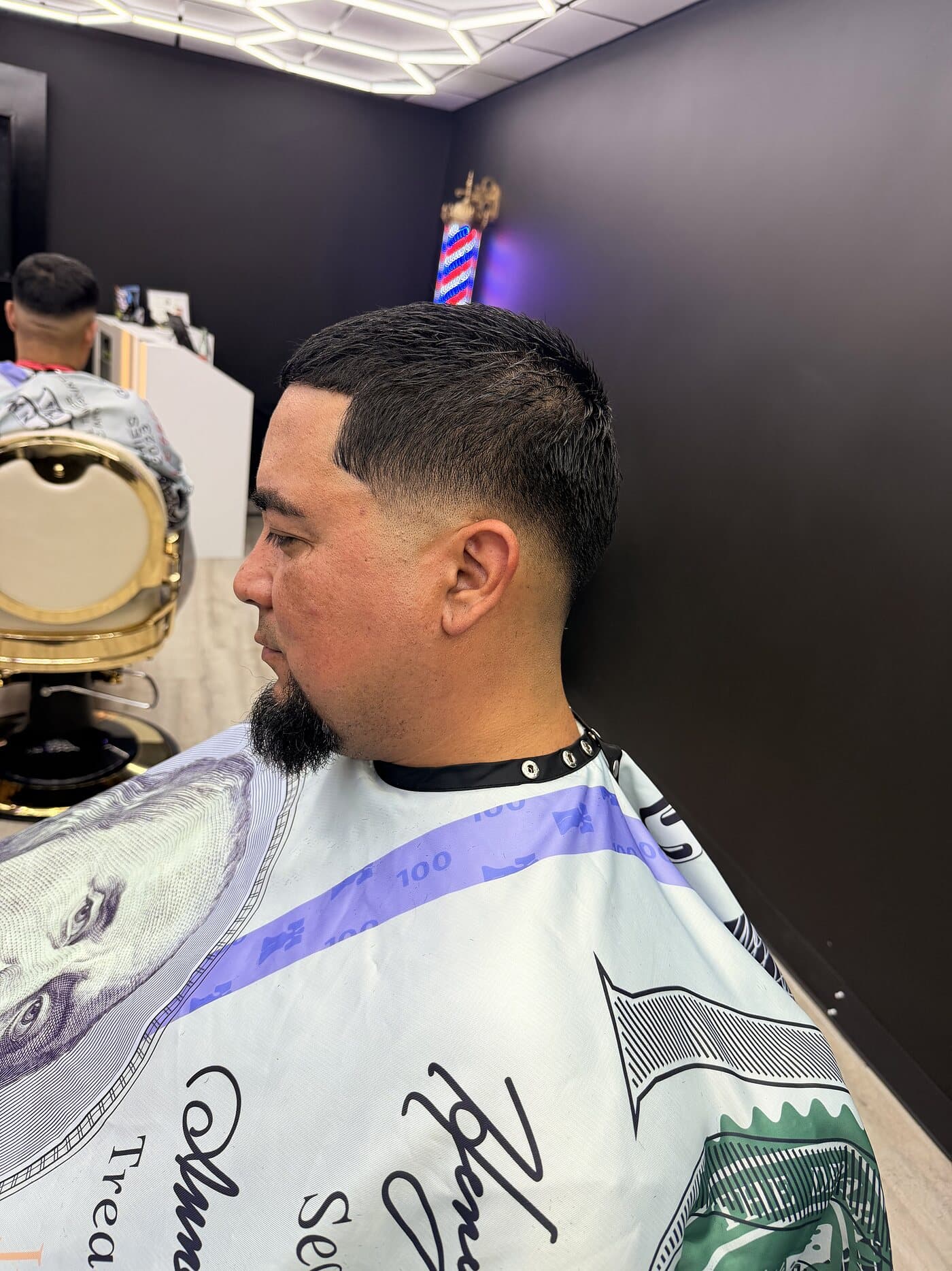 Classic taper haircut with a sharp beard line