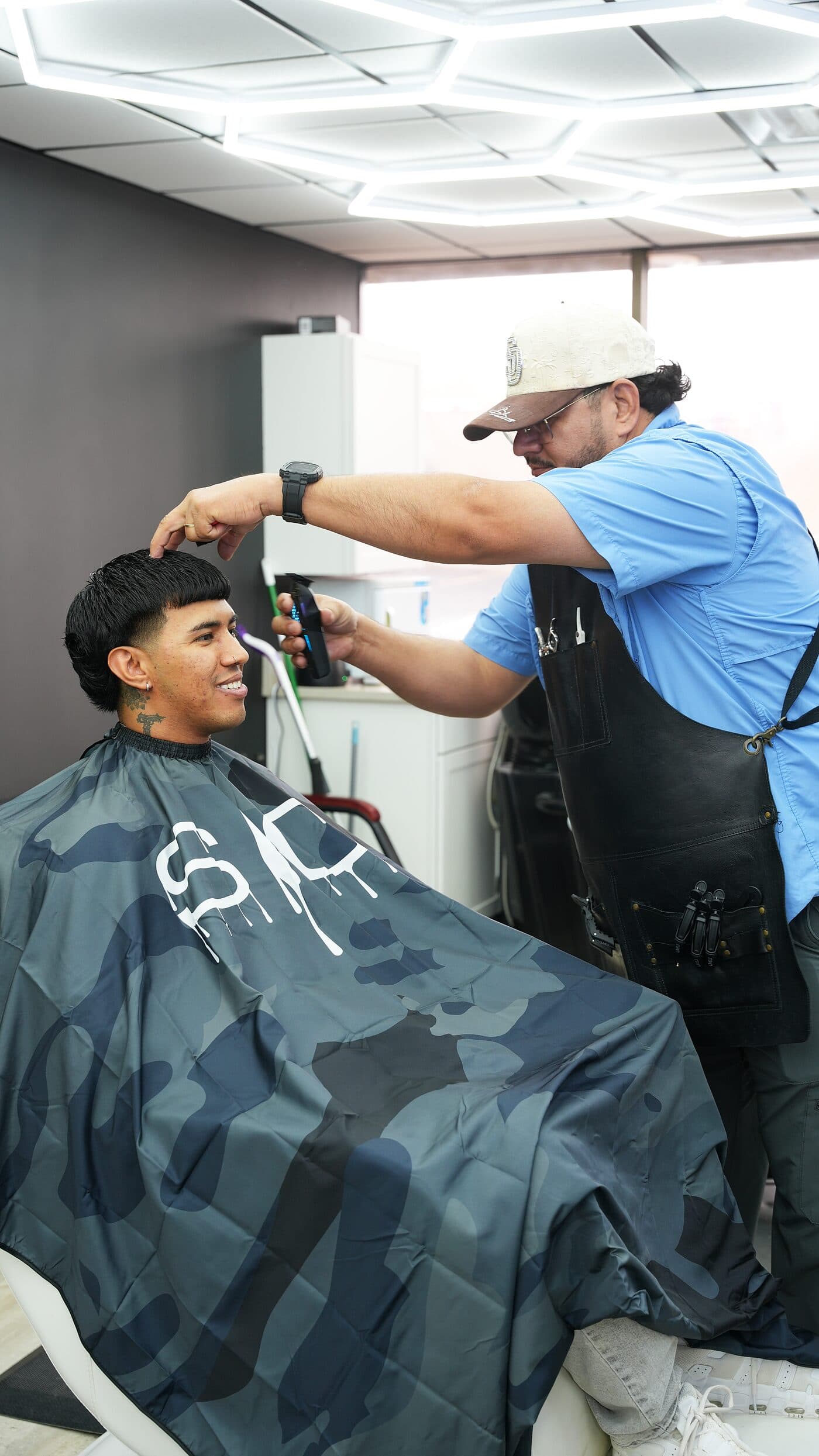 Clipper work shaping a fade in the barber chair